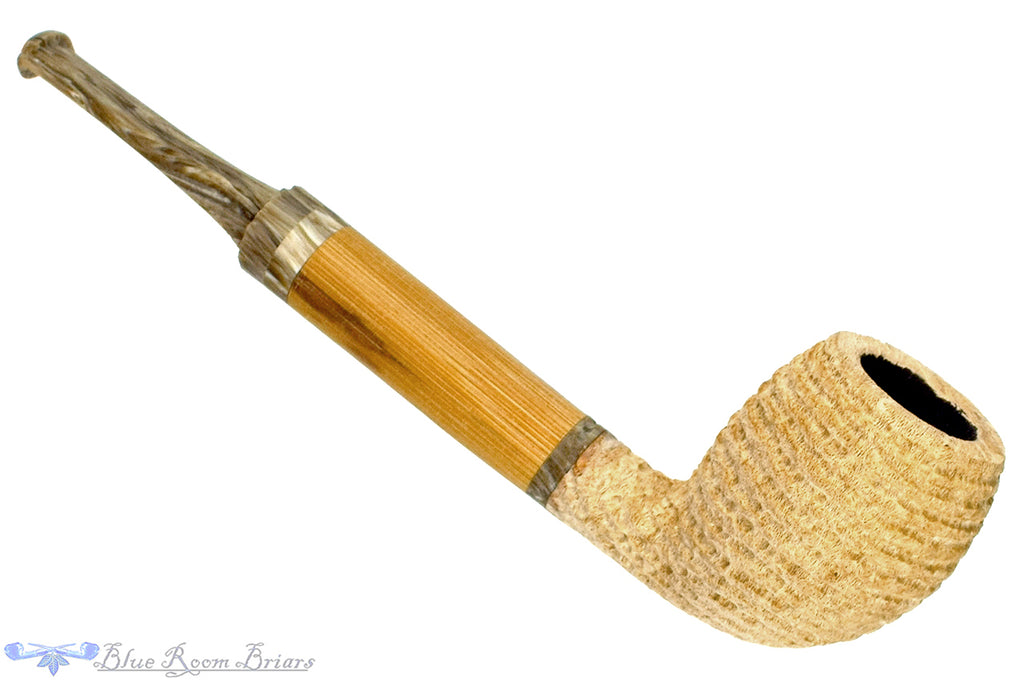 Blue Room Briars is proud to present this Brian Orton Pipe Carved Driftwood Belge with Bamboo