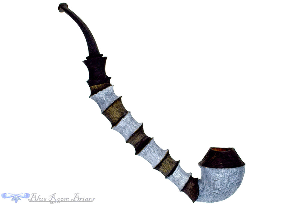 Blue Room Briars is proud to present this Brian Orton Pipe Bent Carved Driftwood Rhodesian with Bamboo and Shank Extension