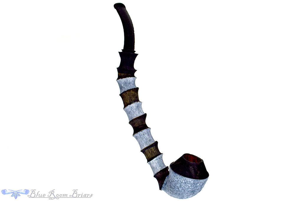 Blue Room Briars is proud to present this Brian Orton Pipe Bent Carved Driftwood Rhodesian with Bamboo and Shank Extension