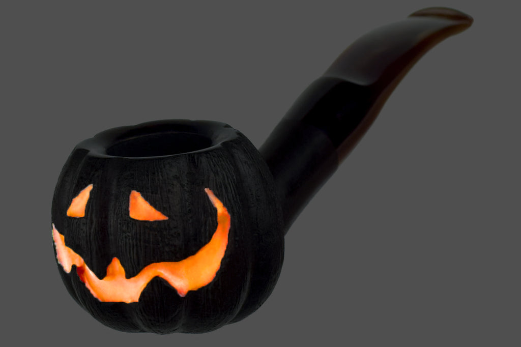Blue Room Briars is proud to present this Blue Room Briars Pipe 2025 Halloween Bent Carved Glow in the Dark Jack-O'-Lantern