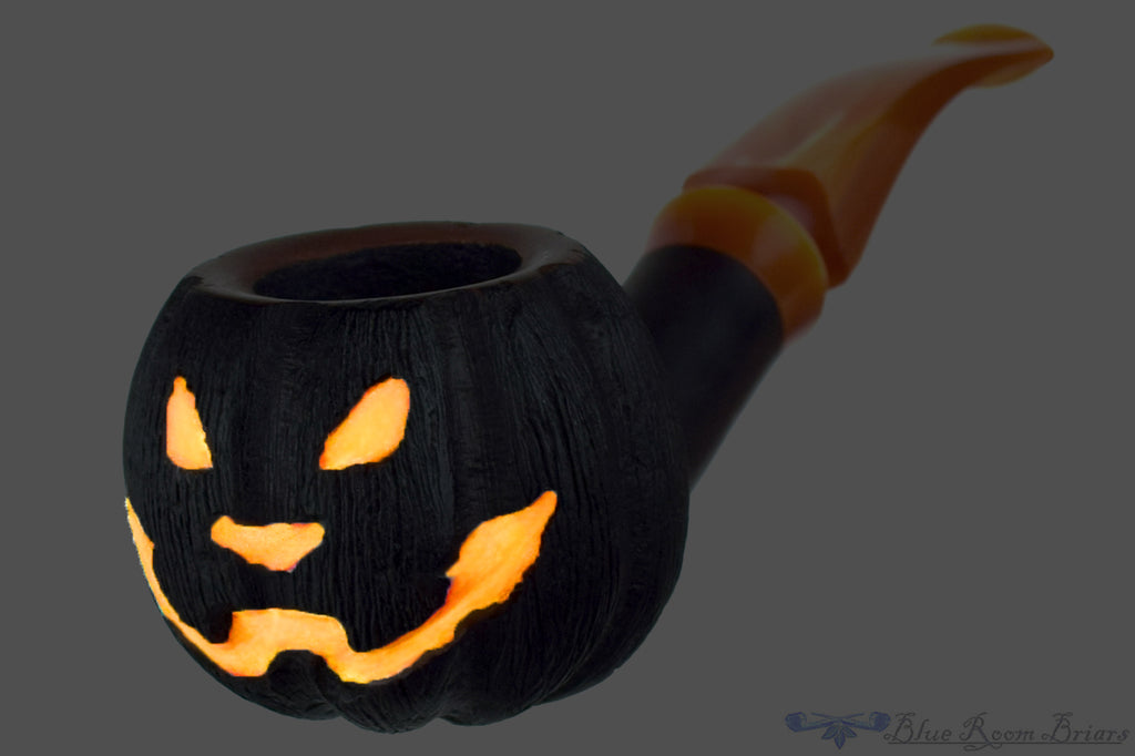 Blue Room Briars is proud to present this Blue Room Briars Pipe 2025 Halloween Bent Carved Glow in the Dark Jack-O'-Lantern