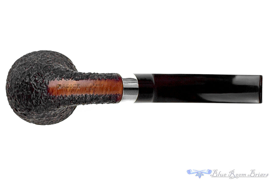 Blue Room Briars is proud to present this Radice Rind Rusticated Bent Rhodesian with Silver Estate Pipe