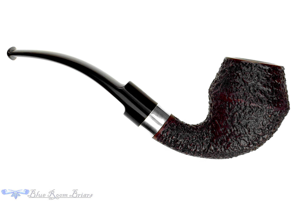 Blue Room Briars is proud to present this Radice Rind Rusticated Bent Rhodesian with Silver Estate Pipe