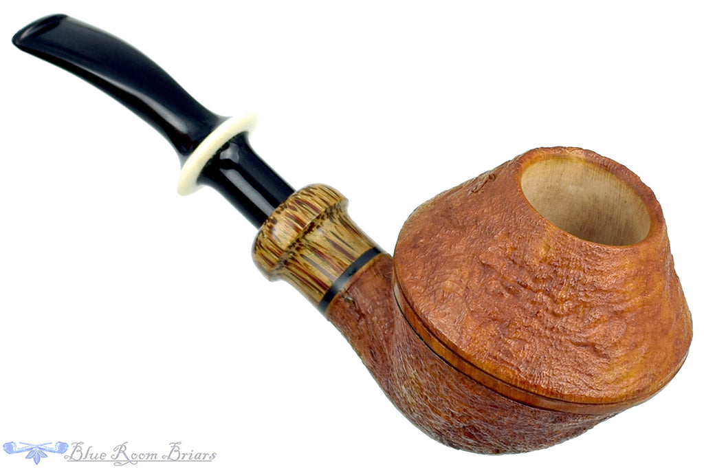 Blue Room Briars is proud to present this Ron Powell Pipe 1/8 Bent Sandblast Rhodesian Sitter with Red Palm Ferrule and Ivorite Stem Insert