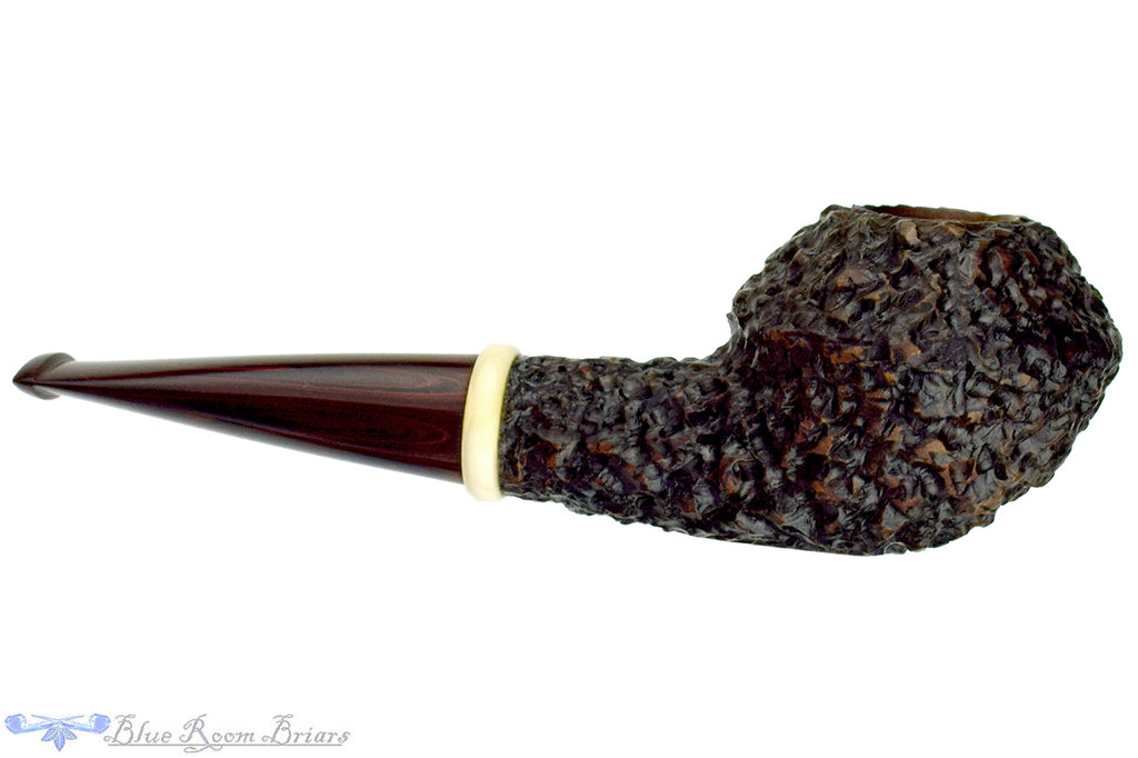 Blue Room Briars is proud to present this Jan Pietenpauw Rusticated Rhodesian Sitter with Warthog Tusk and Brindle Twin Bore Stem Estate Pipe