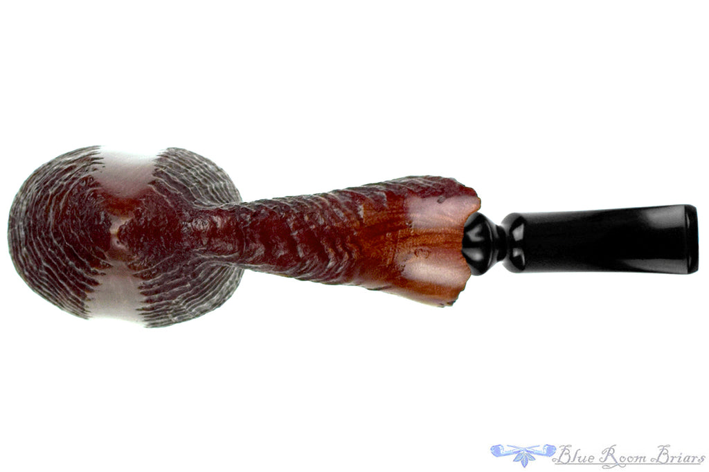 Blue Room Briars is proud to present this Nørding Handcrafted 3 Bent Partial Blast Freehand with Plateaux Estate Pipe