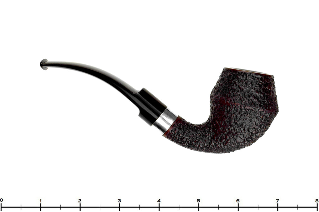 Blue Room Briars is proud to present this Radice Rind Rusticated Bent Rhodesian with Silver Estate Pipe