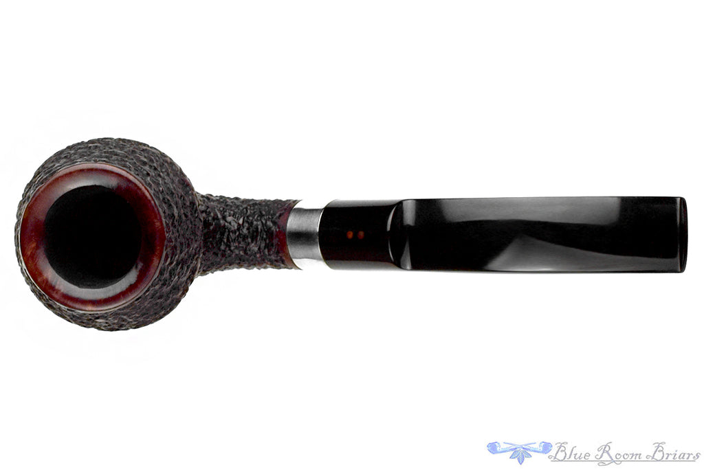 Blue Room Briars is proud to present this Radice Rind Rusticated Bent Rhodesian with Silver Estate Pipe