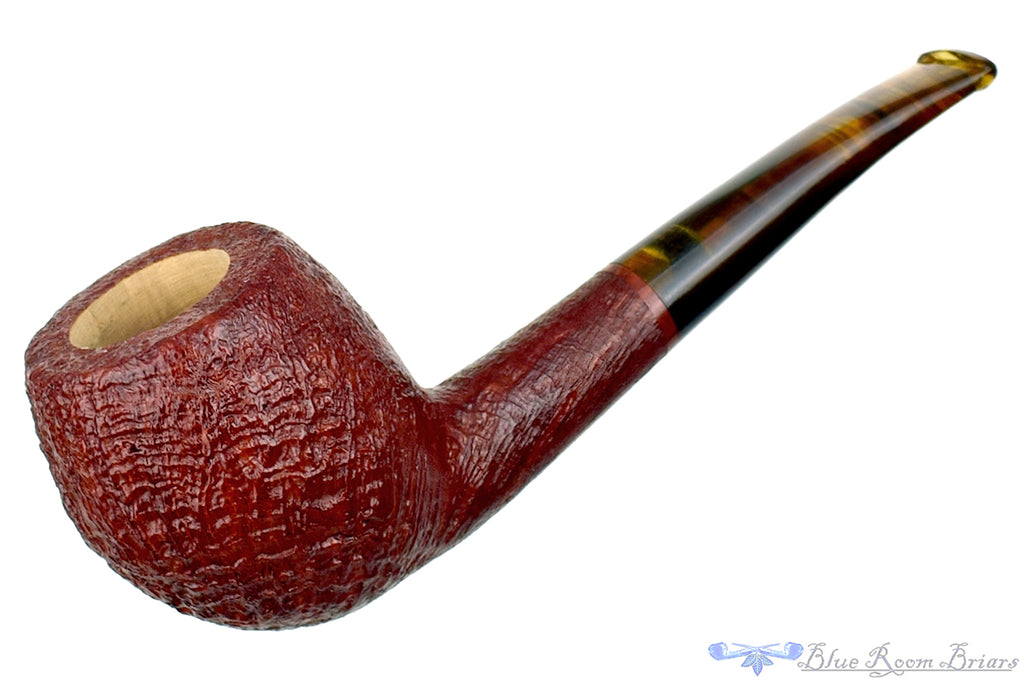 Blue Room Briars is proud to present this RC Sands Pipe Bent Sandblast Apple with Dark Amber Stem