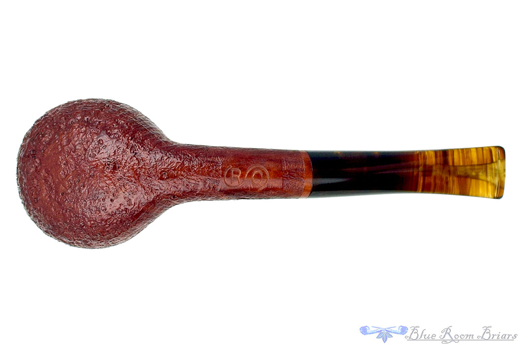 Blue Room Briars is proud to present this RC Sands Pipe Bent Sandblast Apple with Dark Amber Stem